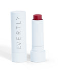 Rose Lip Butter in a sleek white tube, offering nourishing hydration for lips.