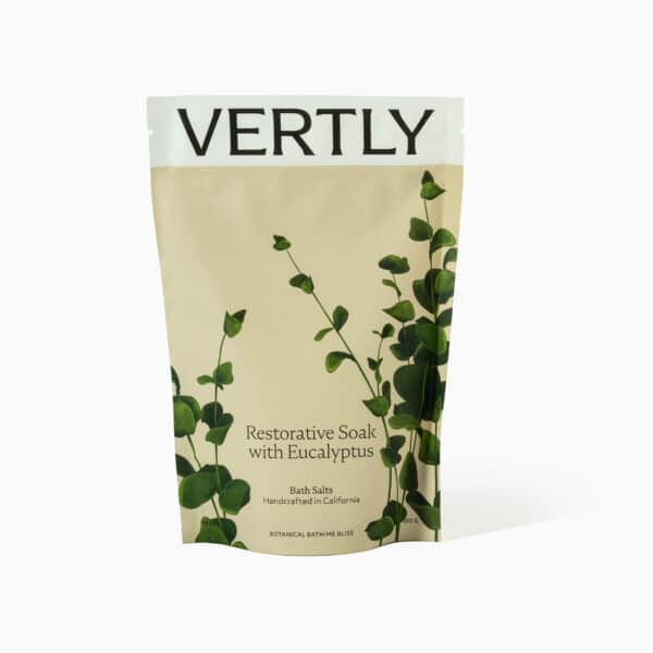 A bag of vertly tea with green leaves on it.